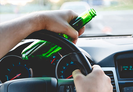 individual driving with an open bottle